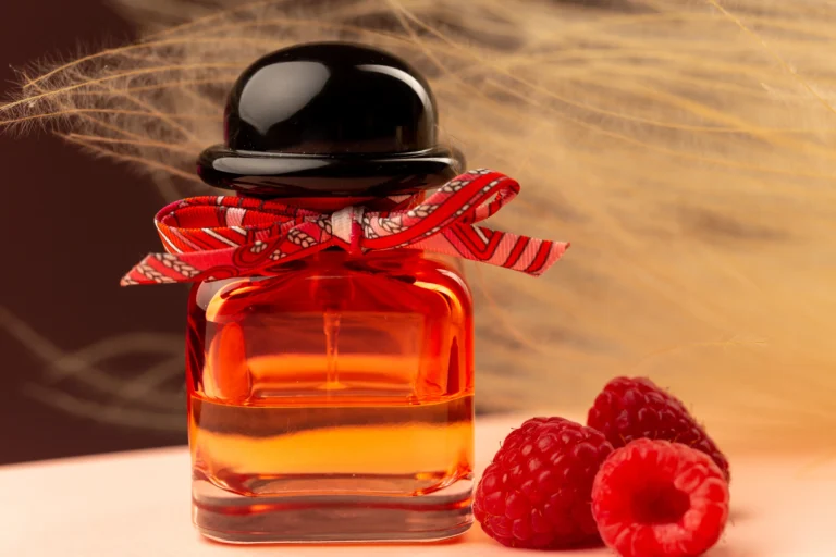 How to Choose the Perfect Cologne for Every Occasion front close view raspberry smelling perfume inside flask purple surface